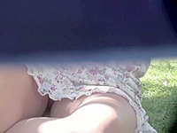 Sweet cutie has set her cute round ass on the green park lawn having no idea the man sitting next to was spying her enjoyable pink panty upskirt.